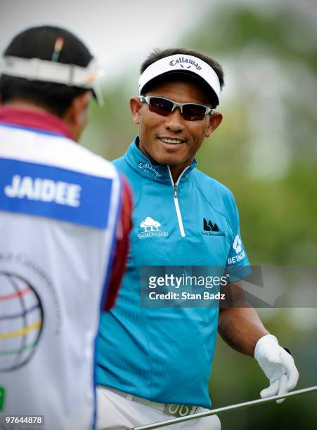 Thongchai Jaidee of Thailand smiles on the practice range during the first round of the World Golf Championships-CA Championship at Doral Golf Resort...