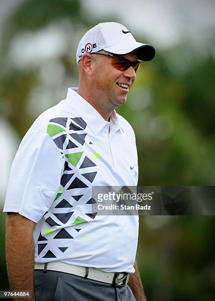 Stewart Cink smiles on the practice range during the first round of the World Golf Championships-CA Championship at Doral Golf Resort and Spa on...