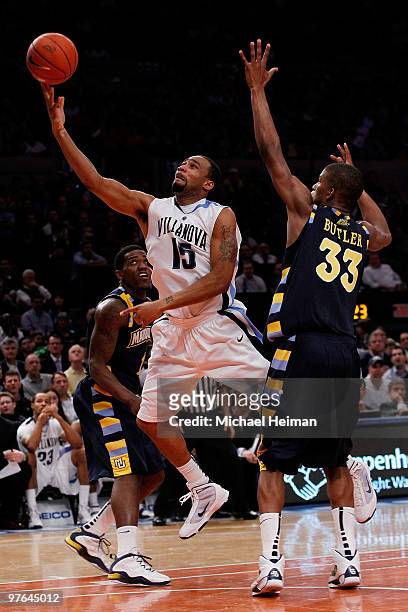 Reggie Redding of the Villanova Wildcats goes to the hoop against Jimmy Butler of the Marquette Golden Eagles during the quarterfinal of the 2010...
