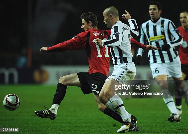 Fabio Cannavaro of Juventus FC battles for the ball with Zoltan Gera of Fulham FC during the UEFA Europa League last 16, first leg match between...