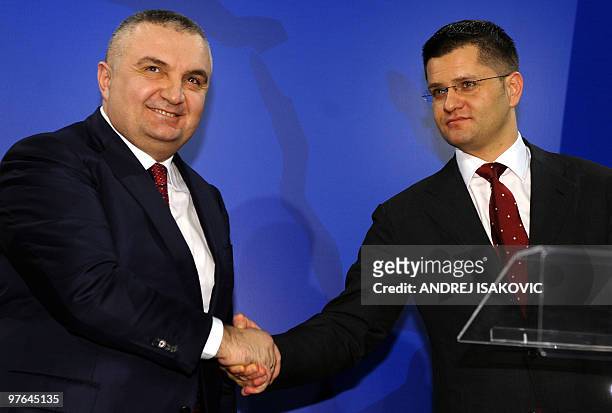 Serbian Foreign Minister Vuk Jeremic shake hands with his Albanian counterpart Ilir Meta after their meeting in Belgrade on March 11, 2010. AFP PHOTO...
