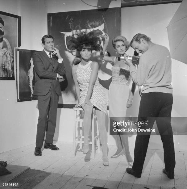 From left to right, Gene Barry, Elsa Martinelli, Cyd Charisse and Leslie Phillips in a Chelsea studio to film a fashion shoot for the Paramount movie...