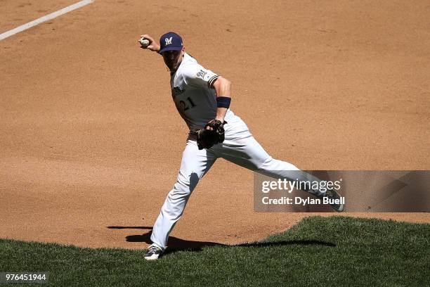 Travis Shaw of the Milwaukee Brewers throws to first base in the fourth inning against the Chicago Cubs at Miller Park on June 13, 2018 in Milwaukee,...