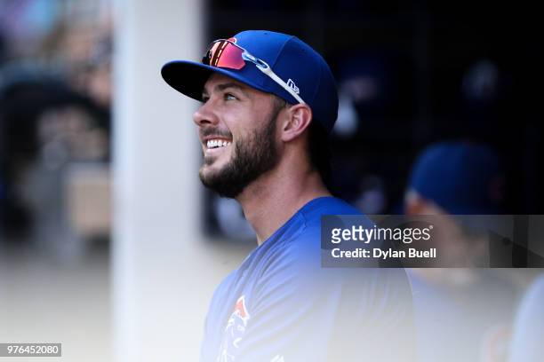 Kris Bryant of the Chicago Cubs walks through the dugout in the eighth inning against the Milwaukee Brewers at Miller Park on June 13, 2018 in...