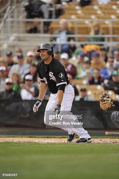 Carlos Quentin of the Chicago White Sox bats during a spring training game against the Seattle Mariners on March 8, 2010 at The Ballpark at Camelback...