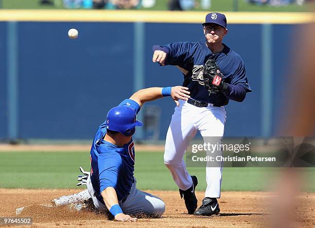 Infielder David Eckstein of the San Diego Padres throws over the sliding Bryan LaHair of the Chicago Cubs to complete a double play during the first...