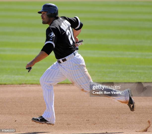 Carlos Quentin of the Chicago White Sox runs the bases against the Cleveland Indians during a spring training game on March 11, 2010 at The Ballpark...