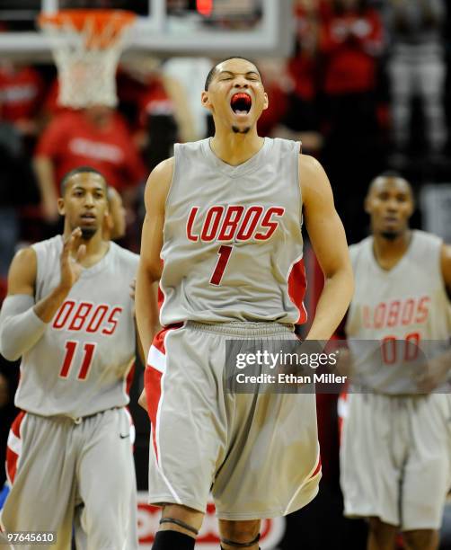 Nate Garth, Darington Hobson and A.J. Hardeman of the New Mexico Lobos react late in their 75-69 quarterfinal game victory over the Air Force Falcons...