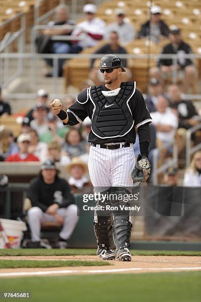 Pierzynski of the Chicago White Sox catches during a spring training game against the Seattle Mariners on March 8, 2010 at The Ballpark at Camelback...