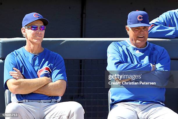 Coach Alan Trammell and manager Lou Piniella of the Chicago Cubs look on during the MLB spring training game against the San Diego Padres at Peoria...