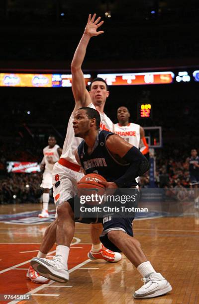 Chris Wright of the Georgetown Hoyas handles the ball against Andy Rautins of the Syracuse Orange during the quarterfinal of the 2010 NCAA Big East...