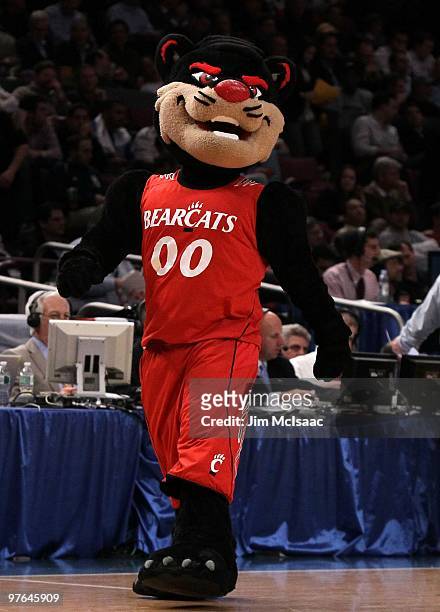 The Cincinnati Bearcats mascot walks on the court against the Louisville Cardinals during the second round of 2010 NCAA Big East Tournament at...