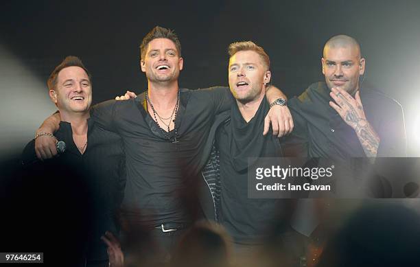 Mikey Graham , Keith Duffy and Shane Lynch from Boyzone join Ronan Keating on stage at The Royal Albert Hall on March 11, 2010 in London, England.
