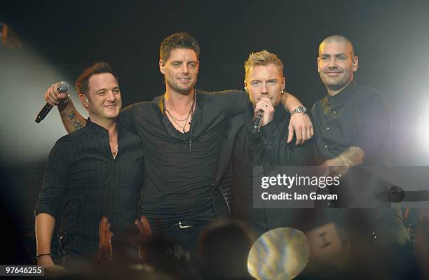 Mikey Graham , Keith Duffy and Shane Lynch from Boyzone join Ronan Keating on stage at The Royal Albert Hall on March 11, 2010 in London, England.