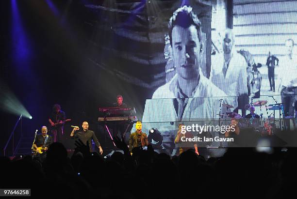 Shane Lynch , Mikey Graham and Keith Duffy from Boyzone join Ronan Keating on stage at The Royal Albert Hall on March 11, 2010 in London, England.