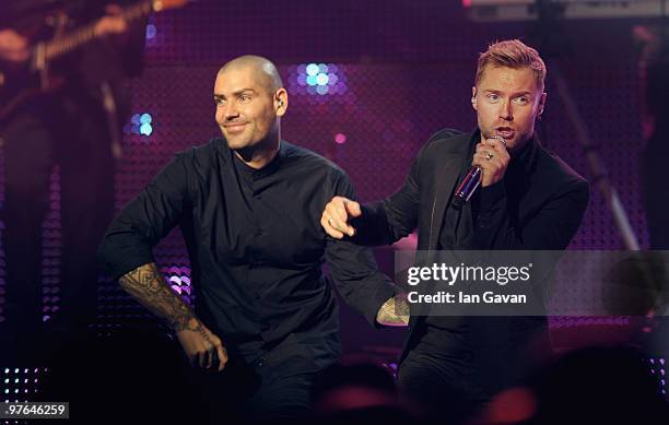 Shane Lynch from Boyzone joins Ronan Keating on stage at The Royal Albert Hall on March 11, 2010 in London, England.