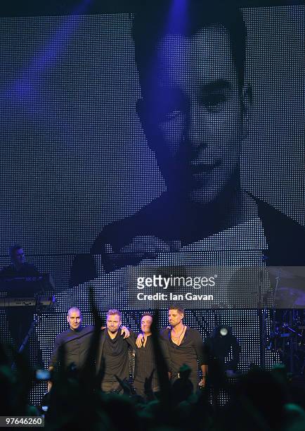 Shane Lynch , Mikey Graham and Keith Duffy from Boyzone join Ronan Keating on stage at The Royal Albert Hall on March 11, 2010 in London, England.
