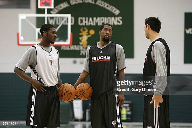 Royal Ivey, John Salmons, and Carlos Delfino of the Milwaukee Bucks talk before practice on March 11, 2010 at the Bucks Training Center in Milwaukee,...