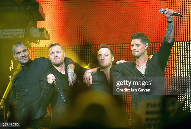 Shane Lynch , Mikey Graham and Keith Duffy from Boyzone join Ronan Keating on stage at The Royal Albert Hall on March 11, 2010 in London, England.