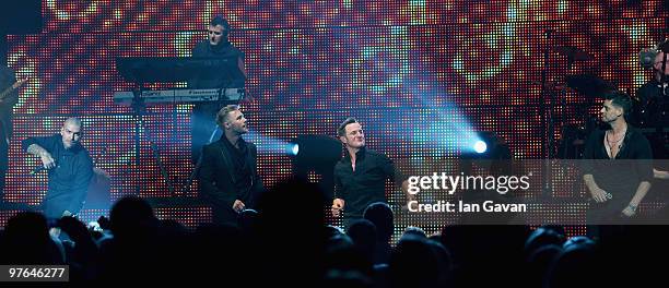 Shane Lynch , Mikey Graham and Keith Duffy from Boyzone join Ronan Keating on stage at The Royal Albert Hall on March 11, 2010 in London, England.