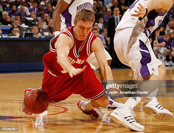 Guard Jordan Hulls of the Indiana Hoosiers loses his balance during the game against the Northwestern Wildcats in the first round of the Big Ten...