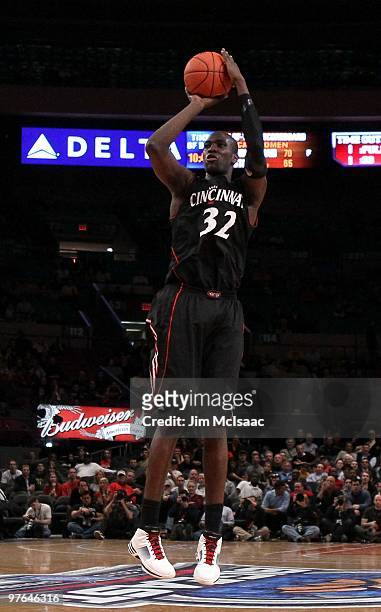 Ibrahima Thomas of the Cincinnati Bearcats shoots against the Louisville Cardinals during the second round of 2010 NCAA Big East Tournament at...