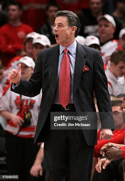 Head coach Rick Pitino of the Louisville Cardinals reacts from the bench against the Cincinnati Bearcats during the second round of 2010 NCAA Big...