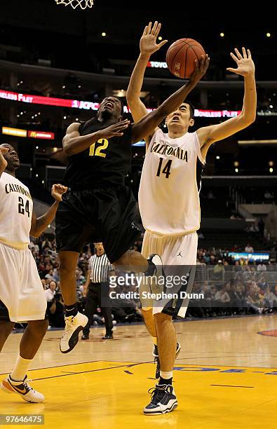 Tajuan Porter of the Oregon Ducks shoots over Max Zhang of the California Golden Bears during the quarterfinals of the Pac-10 Basketball Tournament...