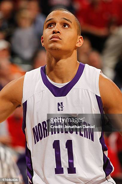 Guard Reggie Hearn of the Northwestern Wildcats looks on during the game against the Indiana Hoosiers in the first round of the Big Ten Men's...