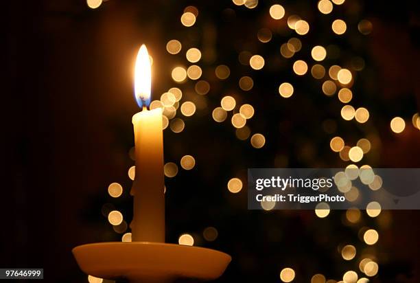 candle light and a christmas tree - candle light stock pictures, royalty-free photos & images