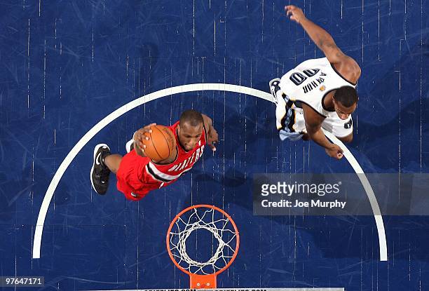 Dante Cunningham of the Portland Trail Blazers dunks against Darrell Arthur of the Memphis Grizzlies during the game at the FedExForum on March 01,...