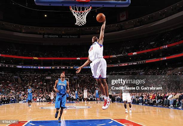 Thaddeus Young of the Philadelphia 76ers dunks during the game against the Orlando Magic at Wachovia Center on March 01, 2010 in Philadelphia,...