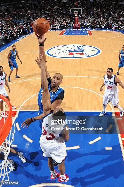 Vince Carter of the Orlando Magic shoots over Willie Green of the Philadelphia 76ers during the game at Wachovia Center on March 01, 2010 in...
