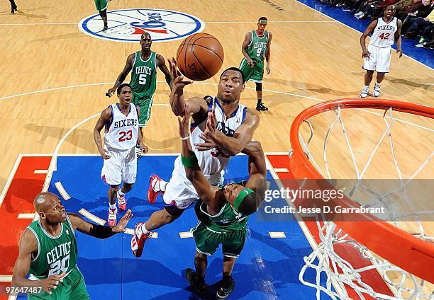 Willie Green of the Philadelphia 76ers shoots a layup against Paul Pierce of the Boston Celtics during the game at Wachovia Center on March 5, 2010...