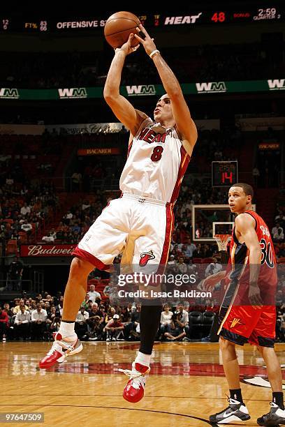 Carlos Arroyo of the Miami Heat shoots a jump shot during the game against the Golden State Warriors at American Airlines Arena on March 2, 2010 in...