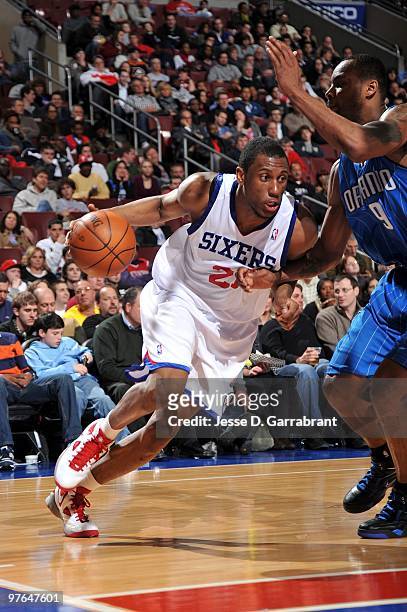 Thaddeus Young of the Philadelphia 76ers drives to the basket against Rashard Lewis of the Orlando Magic during the game at Wachovia Center on March...