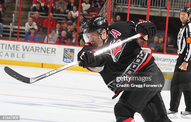 Ray Whitney of the Carolina Hurricanes fires a shot and scores a first period goal during a NHL game against the Pittsburgh Penguins on March 11,...