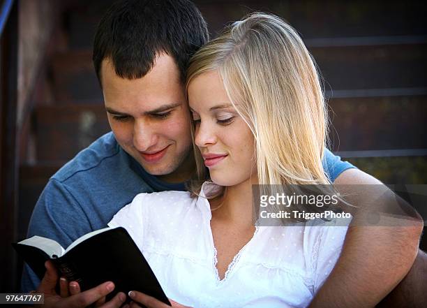 bible study - couple praying stock pictures, royalty-free photos & images
