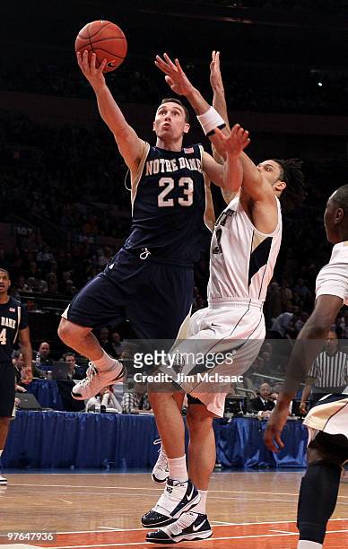 Ben Hansbrough of the Notre Dame Fighting Irish goes to the hoop against Gary McGhee of the Pittsburgh Panthers during the quarterfinal of the 2010...