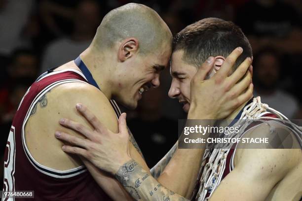 Bayern Munich's center Maik Zirbes and Bayern Munich's Serbian guard Stefan Jovic react during the winners ceremony after winning the German...