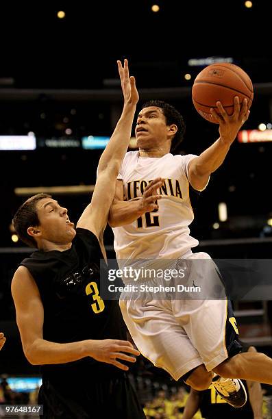 Brandon Smith of the California Golden Bears shoots over Garrett Sims of the Oregon Ducks during the quarterfinals of the Pac-10 Basketball...