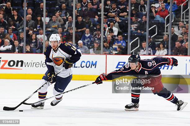 Samuel Pahlsson of the Columbus Blue Jackets attempts to steal the puck from Niclas Bergfors of the Atlanta Thrashers during the second period on...