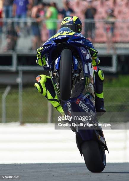 Valentino Rossi of Italy and Movistar Yamaha MotoGP lifts the front wheel during free practice for the MotoGP of Catalunya at Circuit de Catalunya on...