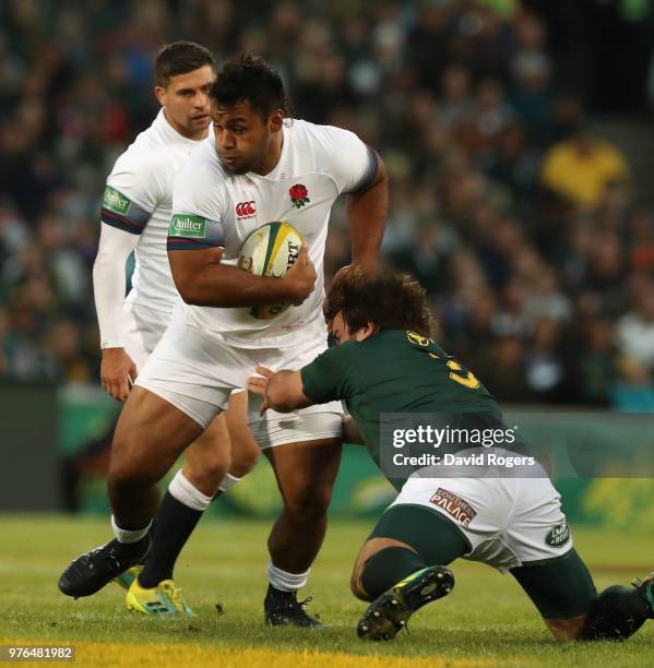 Billy Vunipola of England moves past Frans Malherbe during the second test match between South Africa and England at Toyota Stadium on June 16, 2018...