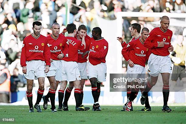 The Manchester United players gather to congratulate Ole Gunnar Solskjaer after score the first goal of the game during the AXA FA Cup Third Round...