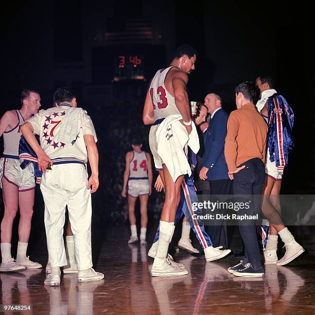 Wilt Chamberlain of the Philadelphia 76ers walks to the sideline during a game played in 1967 at the Boston Garden in Boston, Massachusetts. NOTE TO...