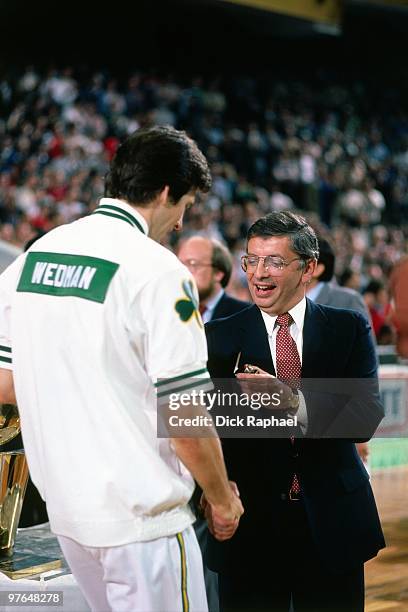 Commissioner David Stern presents Scott Wedman of the Boston Celtics with his ring during the 1984 NBA Championship Ring Ceremony prior to a game...