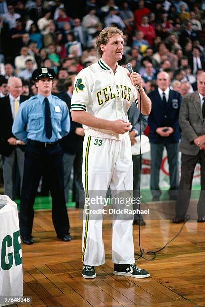 Larry Bird of the Boston Celtics speaks to the crowd during the 1984 NBA Championship Ring Ceremony prior to a game played against the New Jersey...