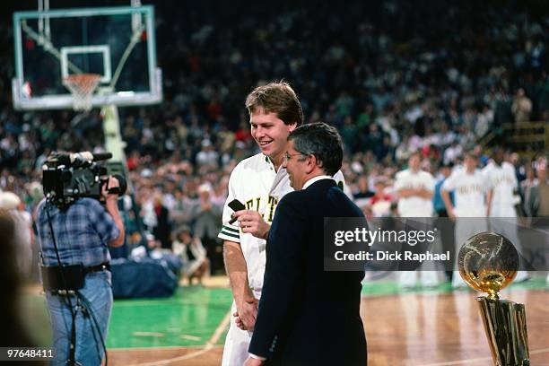 Danny Ainge of the Boston Celtics receives his ring from NBA Commissioner David Stern during the 1984 NBA Championship Ring Ceremony prior to a game...