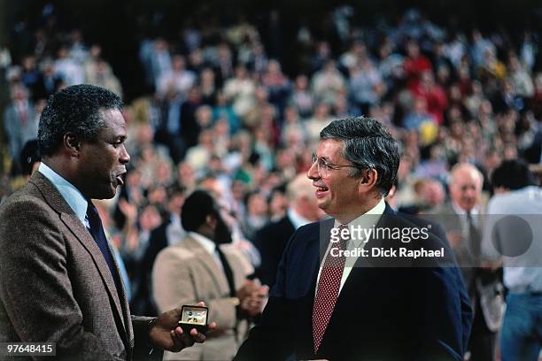 Commissioner David Stern presents Boston Celtics Head Coach K.C. Jones with his ring during the 1984 NBA Championship Ring Ceremony prior to a game...